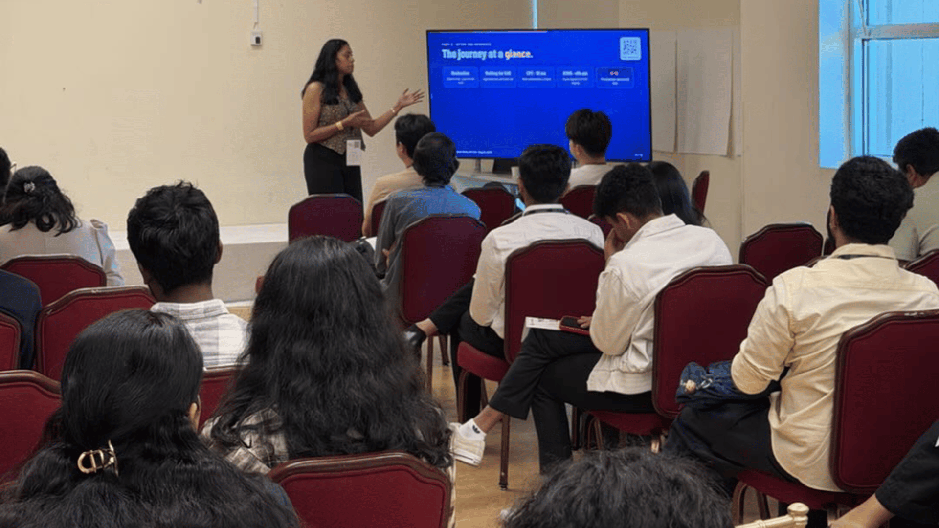 GoElite presents CPT and OPT guidance to international students during the Open Atlas Summit in California.