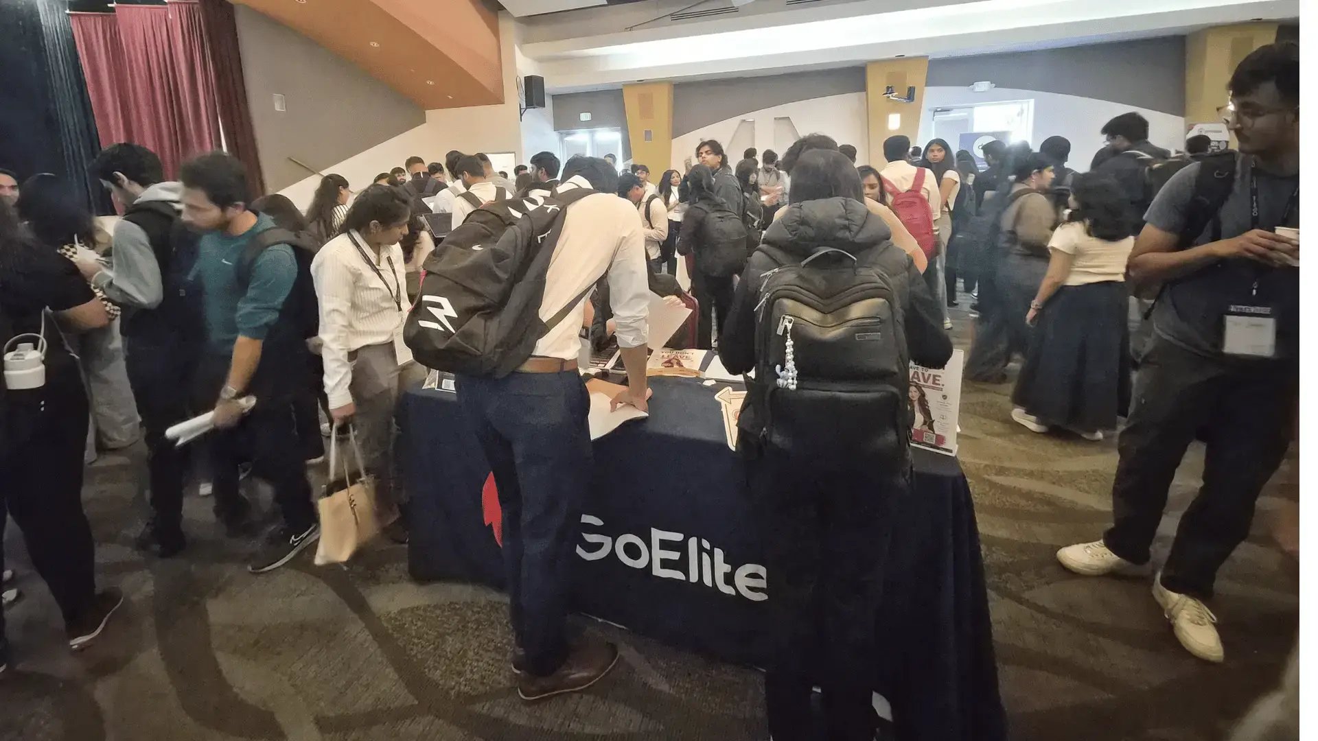 International students visit the GoElite booth during the Open Atlas Summit career fair in Milpitas, California.