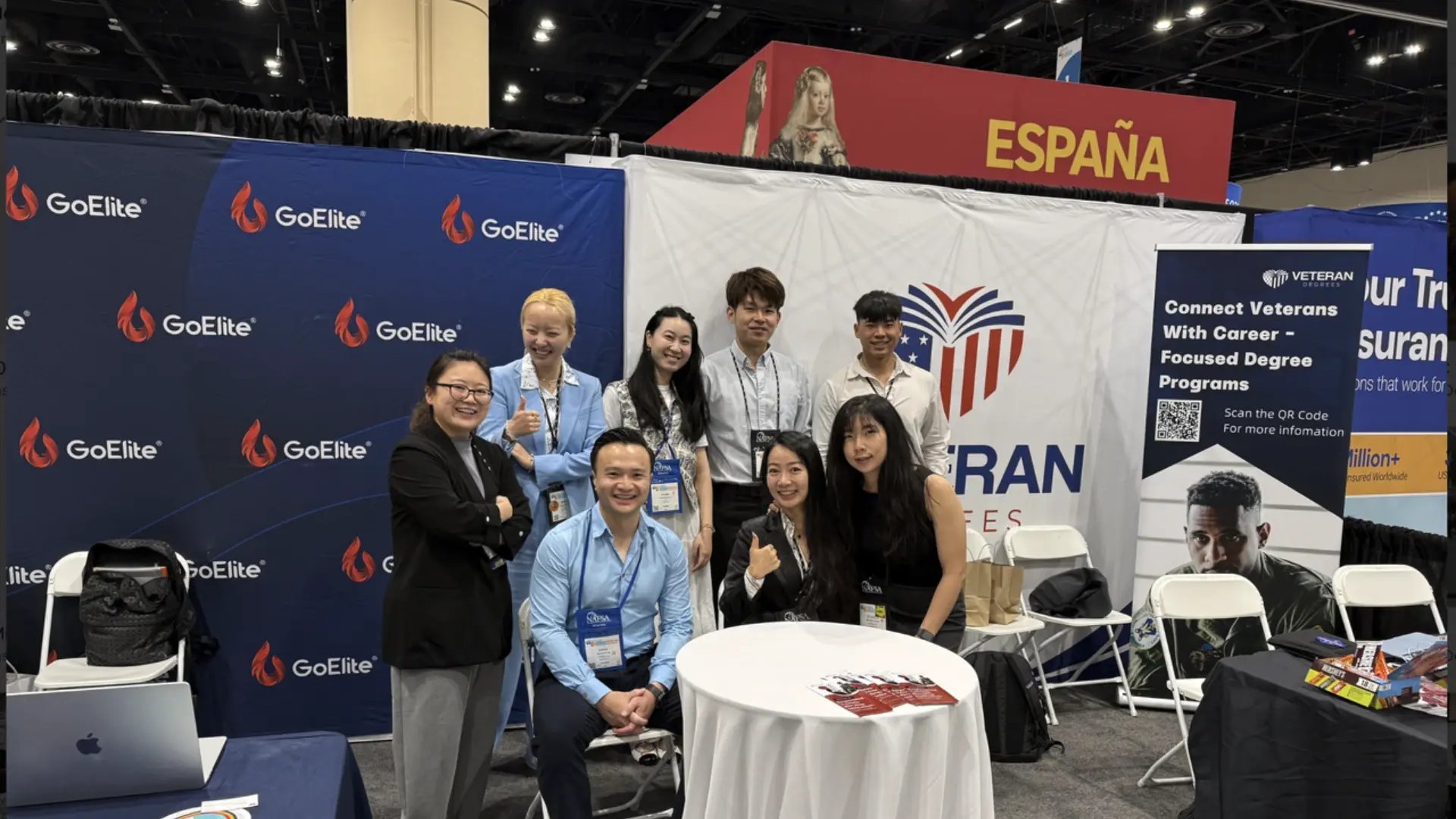 GoElite team members at the NAFSA conference exhibitor booth connecting with education and immigration professionals.