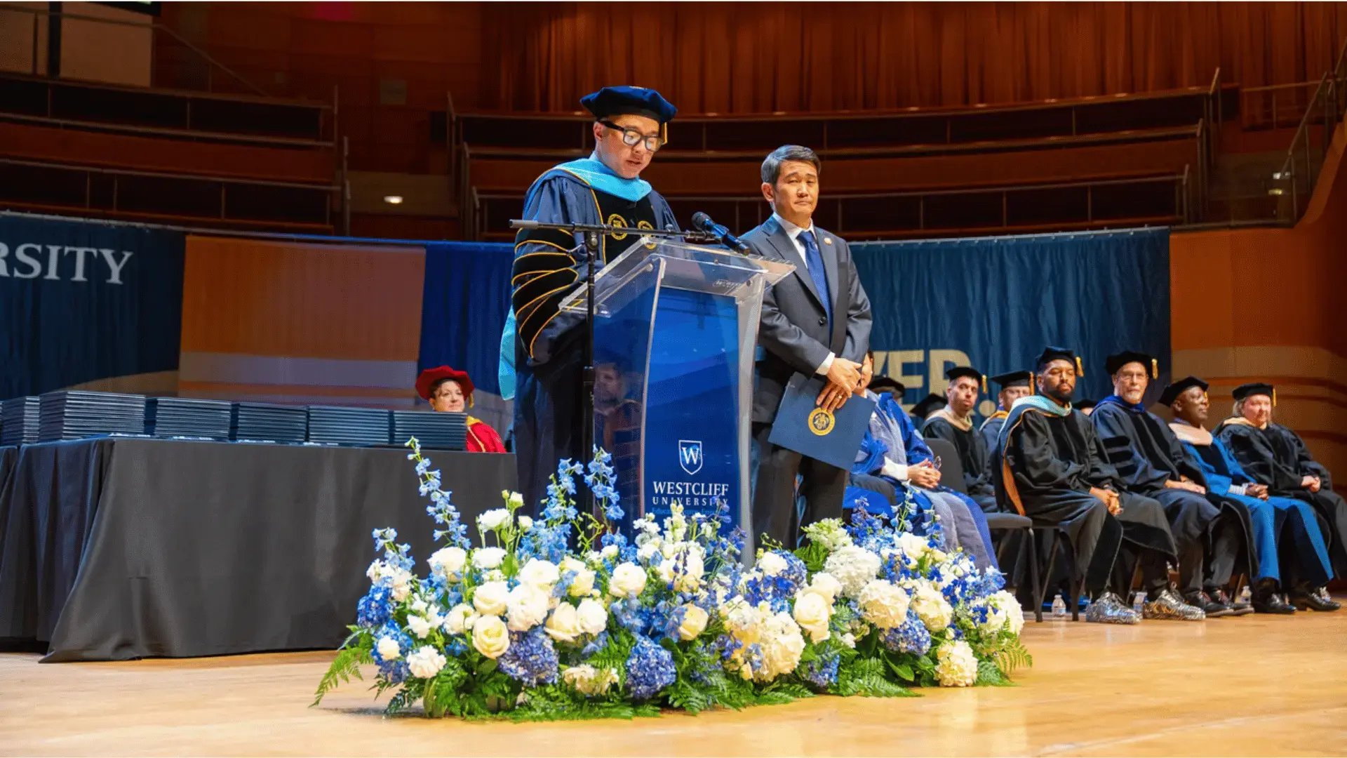 Westcliff University commencement ceremony with GoElite representative recognizing graduating students.