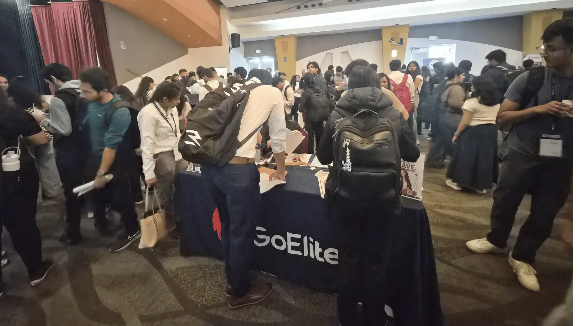 International students visit the GoElite booth during the Open Atlas Summit career fair in Milpitas, California.